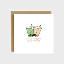 Load image into Gallery viewer, A funny greeting card featuring two cups of milk tea with boba and text that reads, I knew you were my perfect matcha all oolong.