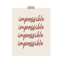 Load image into Gallery viewer, An art print featuring the word “impossible” in calligraphy where the word is separated by two colors for “im” and “possible” hung with a piece of kraft tape on the top.