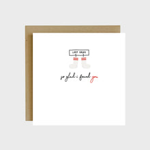 Load image into Gallery viewer, A funny greeting card featuring two matching socks hanging from a lost socks sign and text that reads, So glad I found you.