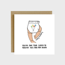 Load image into Gallery viewer, A funny greeting card featuring the back of a baby’s legs and a diaper with colorful balloons on it and text that reads, Happy Birthday, you’re one year closer to rockin’ this bad boy again.
